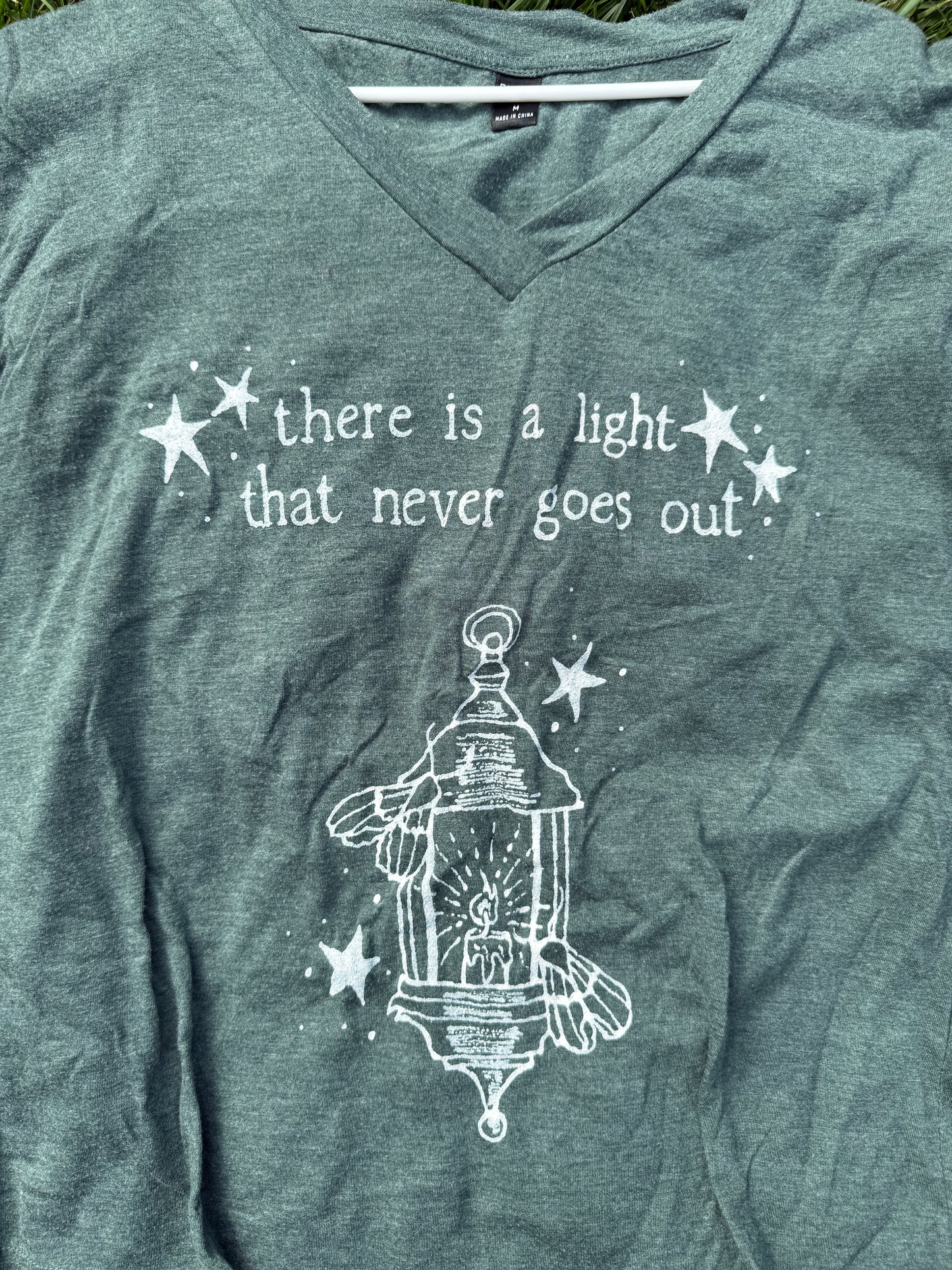 There is a Light Smiths Medium Tshirt