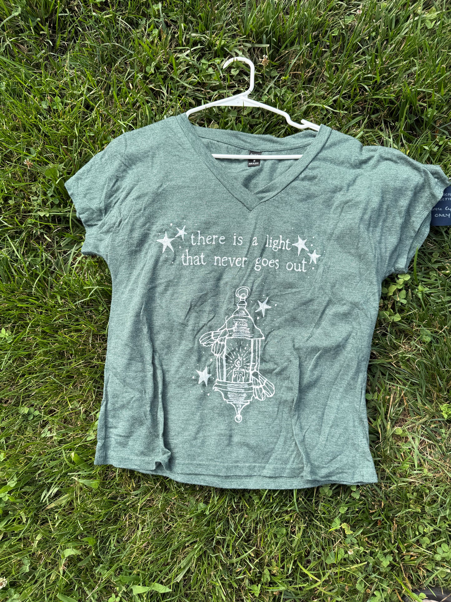 There is a Light Smiths Medium Tshirt