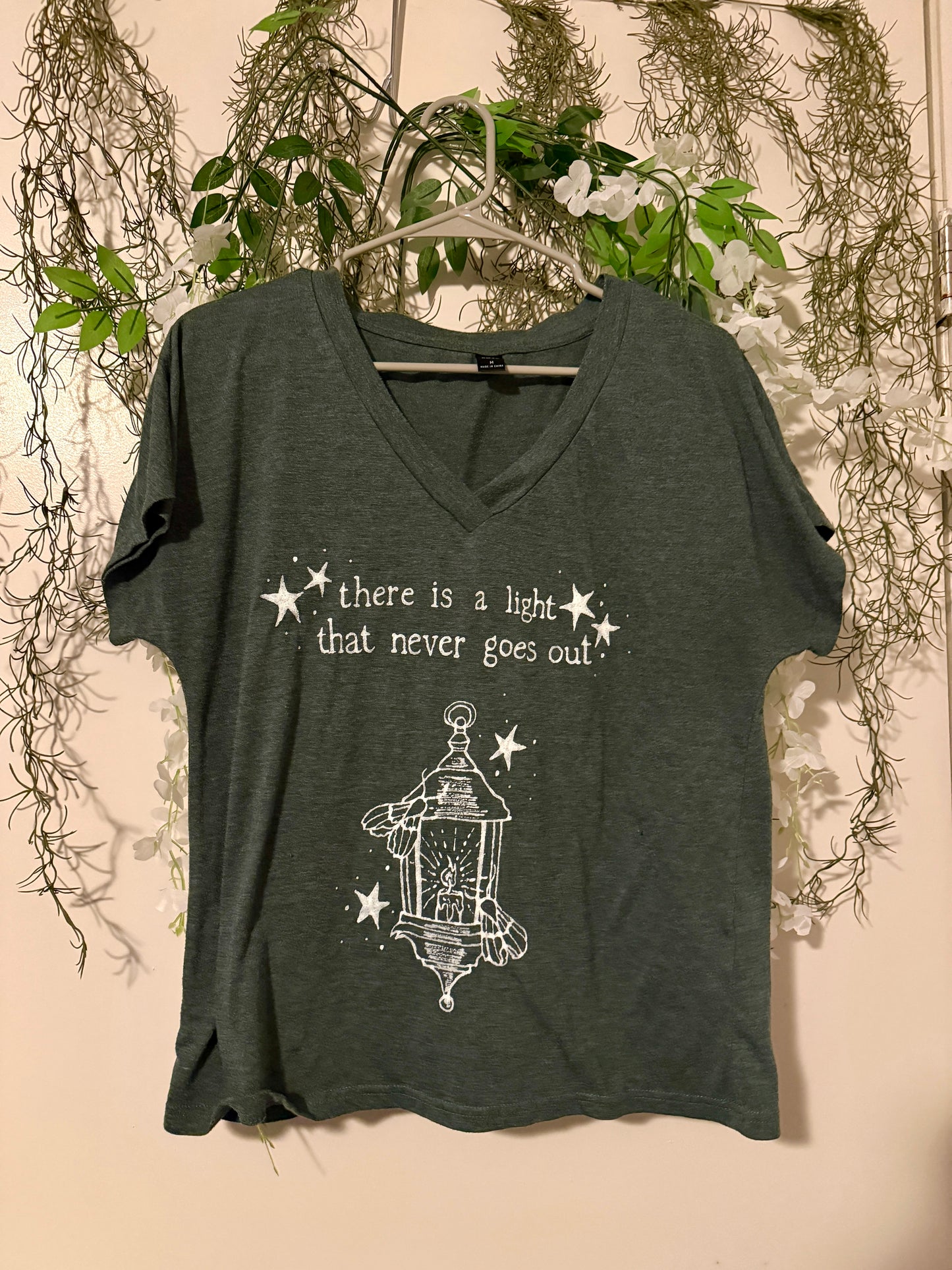 There is a Light Smiths Medium Tshirt