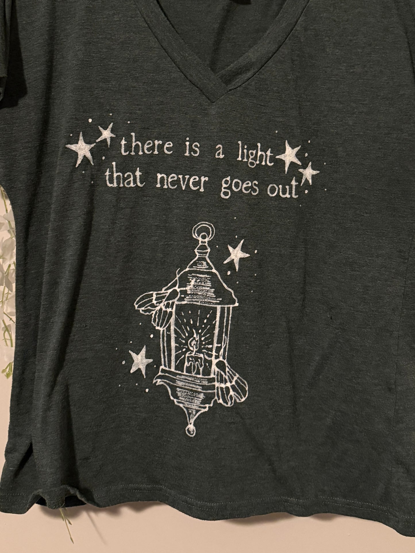 There is a Light Smiths Medium Tshirt